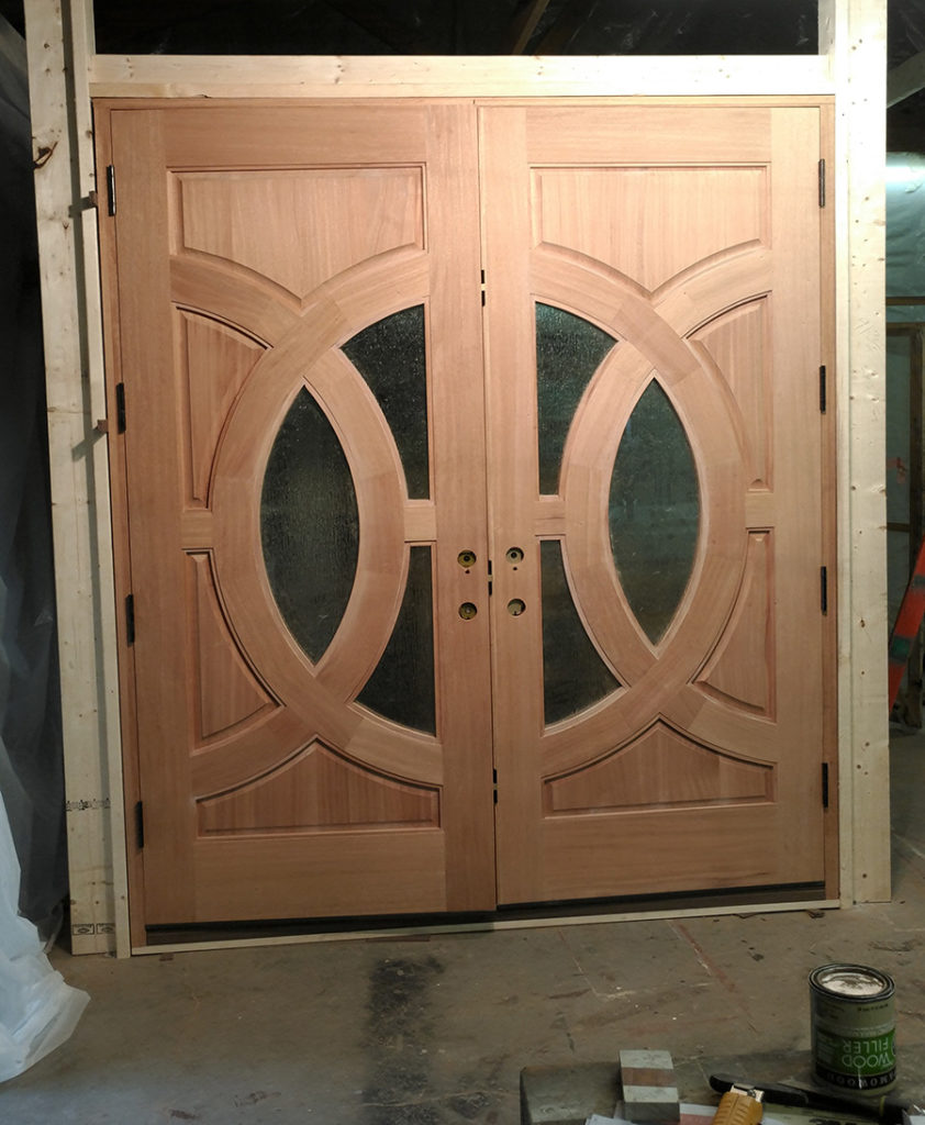 Hanging our custom doors and getting ready to test our installation of the Endura Trilennium® five-point locking system.