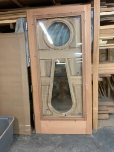 Two inch thick, quarter sawn, white oak door, hand-built here in our shop.