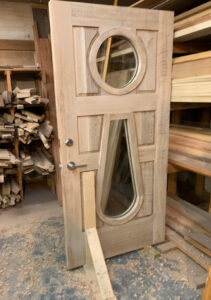 Two inch thick, quarter sawn, white oak door, hand-built here in our shop.