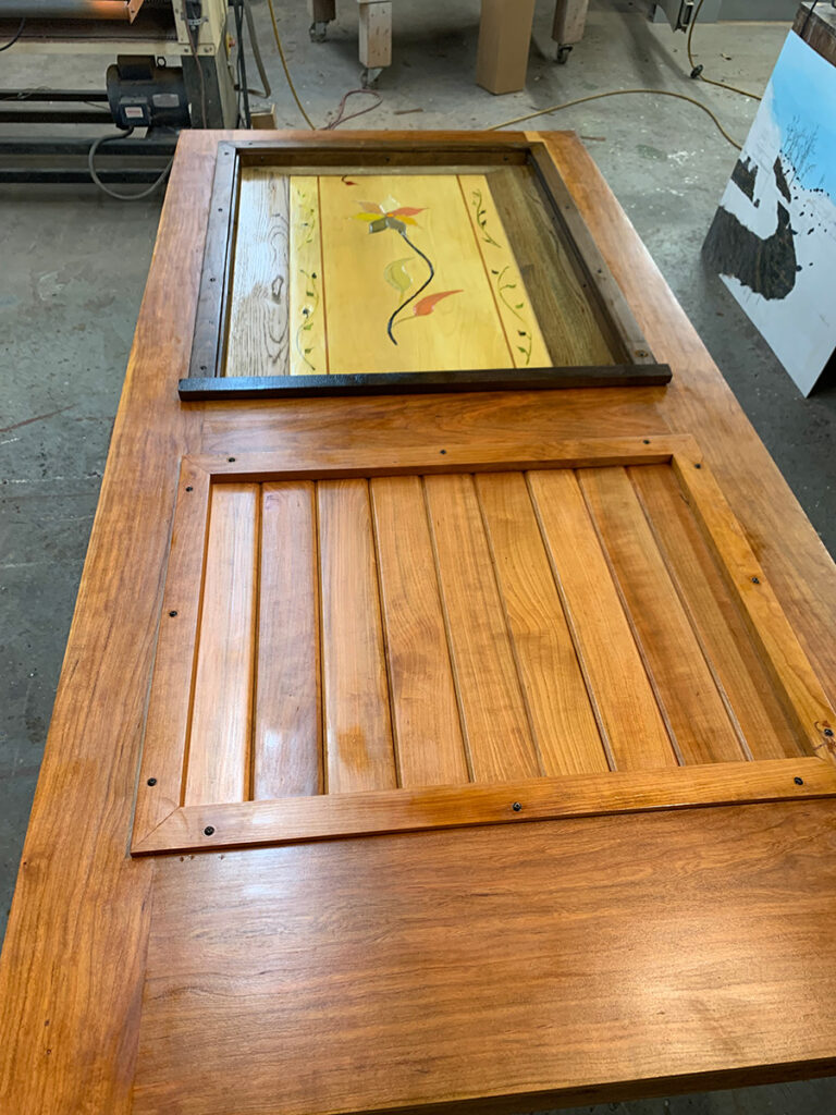 Art panel installed into the custom cherry wood exterior door
