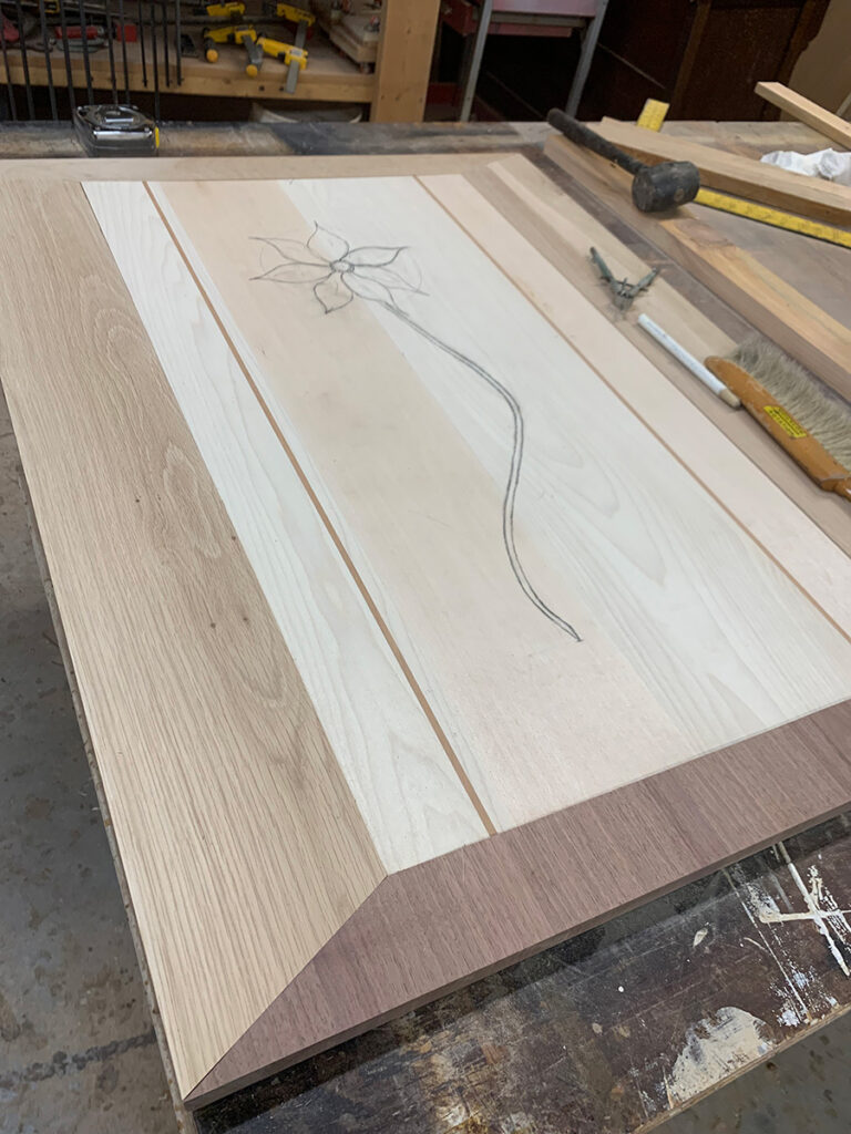Beginning carving on the art panel for a custom hardwood door