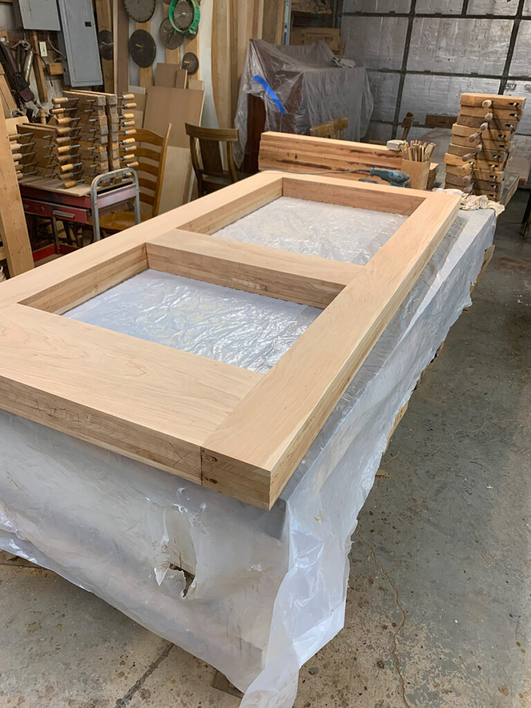 Custom cherry wood door frame for an exterior door